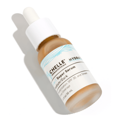 A bottle of MyCHELLE 3-in-1 Super Serum (medium/dark tint version), featuring a dropper dispenser, against a white background.