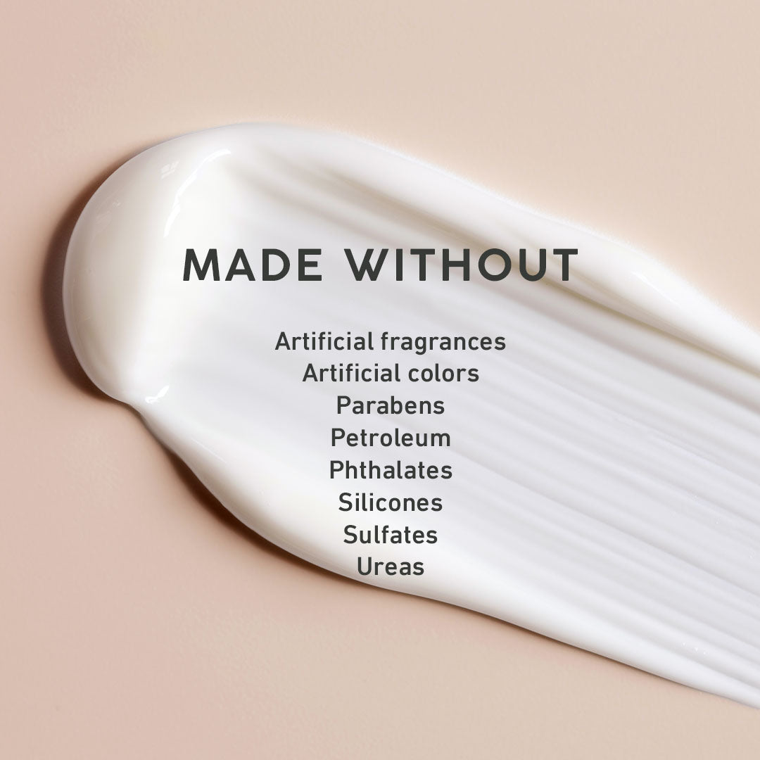 White cream with a list of ingredients it's 'made without' on a beige background