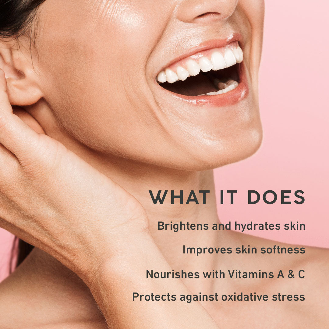 Woman with a close-up of her face, showing skin care benefits with text on a pink background