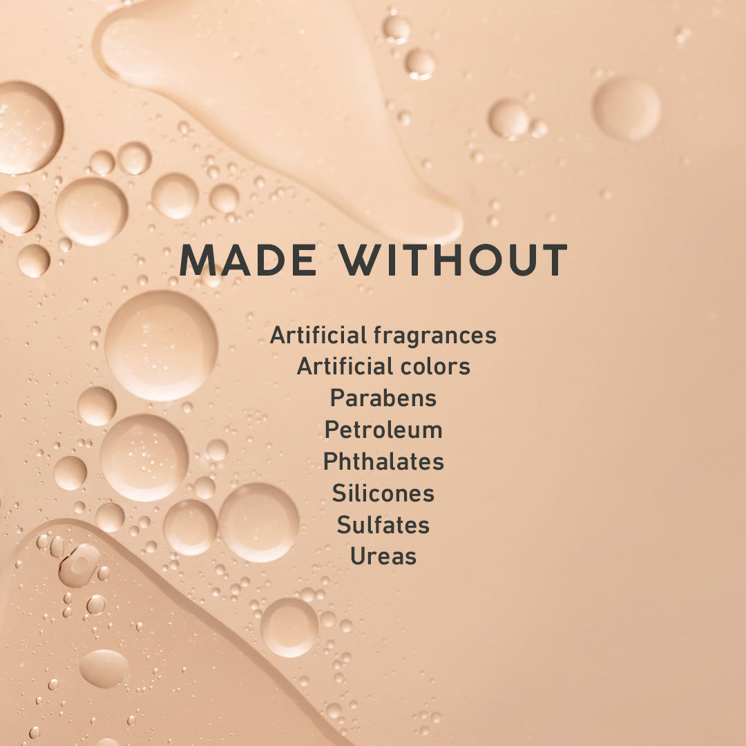 A beige and peach-toned graphic with water droplets and the text 'MADE WITHOUT' followed by a list of excluded ingredients: Artificial fragrances, Artificial colors, Parabens, Petroleum, Phthalates, Silicones, Sulfates, and Ureas.