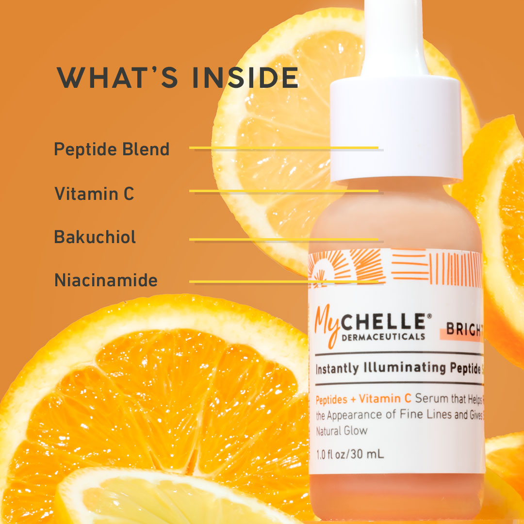 MyChelle skincare serum bottle with ingredients listed and orange slices on an orange background