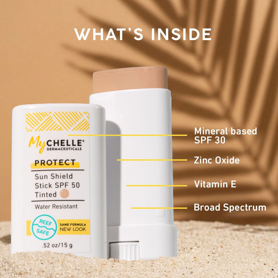 MyChelle Sun Shield Stick with product details on a sand and leaf background