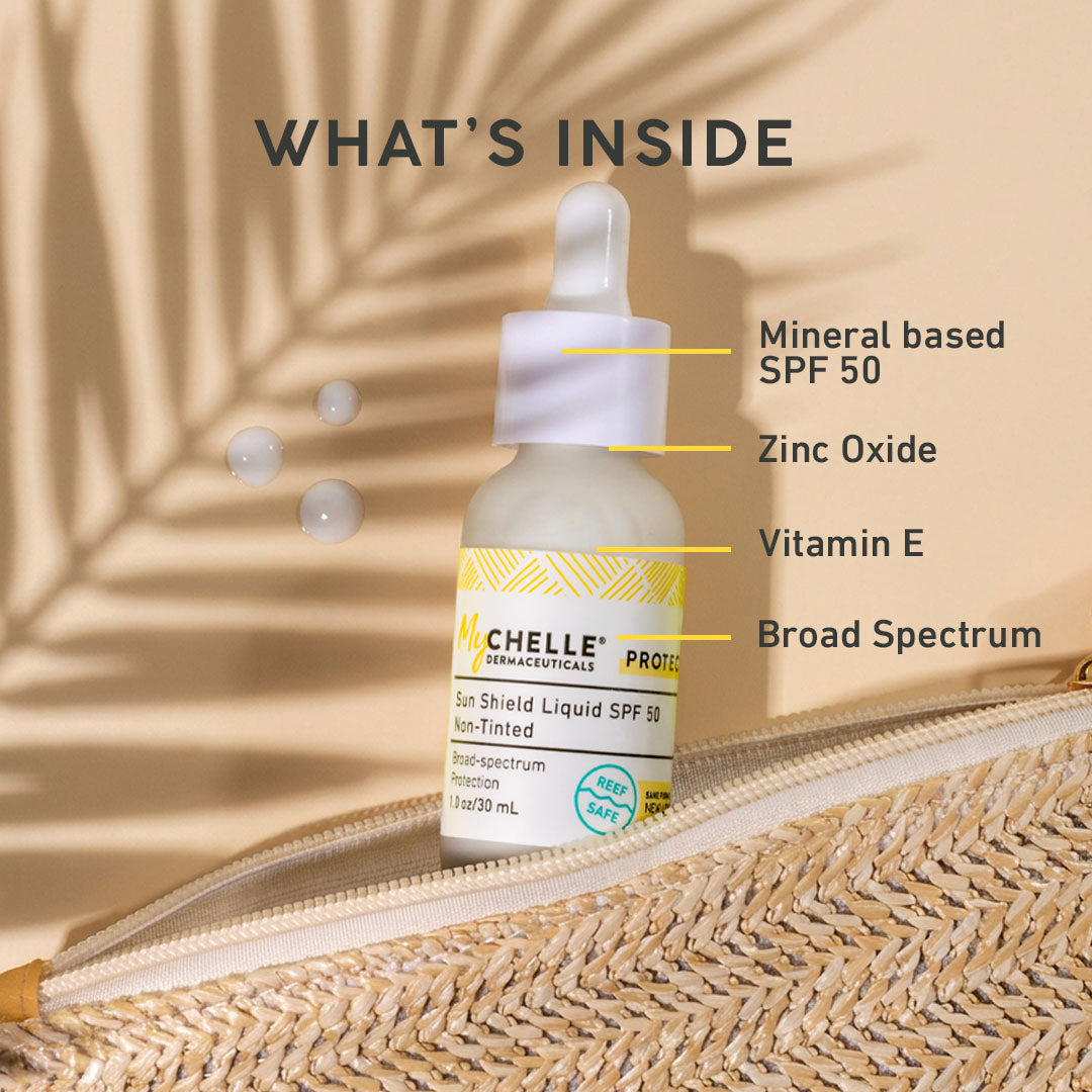 MyCHELLE Sun Shield Liquid SPF 50 bottle with text highlighting ingredients on a natural background
