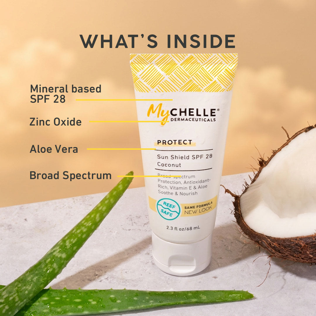 MyChelle Dermaceuticals sunscreen tube with ingredients listed and a coconut and aloe vera plant on a neutral background.