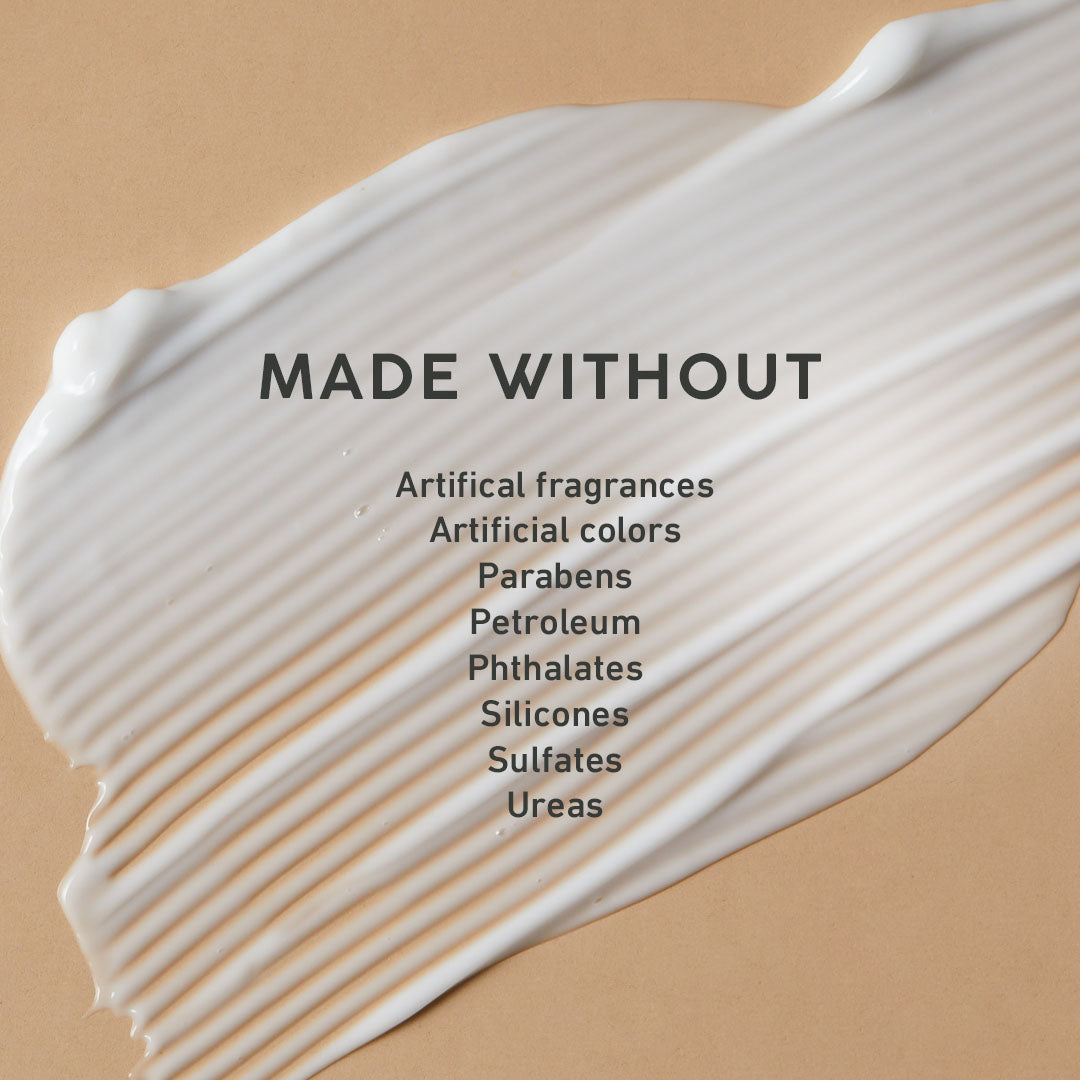 White cream swatch on a beige background with 'MADE WITHOUT' text and listed ingredients.