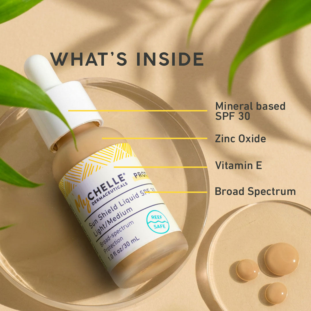 MyCHELLE Sun Shield Liquid Spf 30 bottle with green leaves on a beige background
