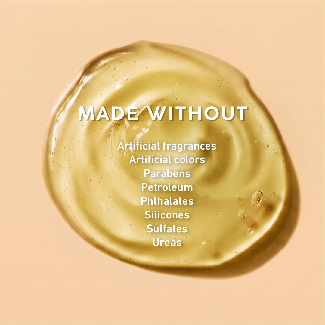 Gold-colored substance with a list of ingredients it's 'made without' on a beige background