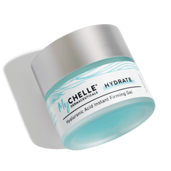 A jar of Hyaluronic Acid Instant Firming Gel by MyChelle Dermaceuticals, with a blue and white label, placed on a shadowed surface.