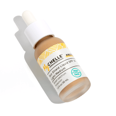 A bottle of MyCHELLE Sun Shield Liquid SPF 30- Light/Medium sunscreen with a white dropper cap.