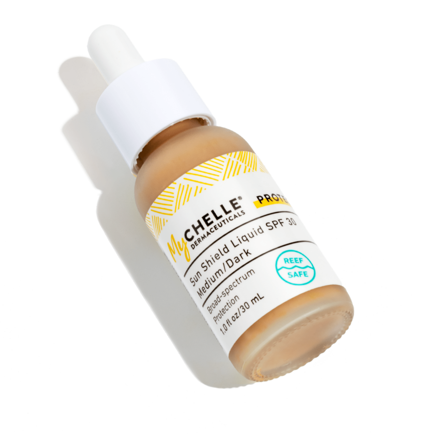 A bottle of Sun Shield Liquid SPF 30 Medium/Dark with a dropper dispenser, with visible mineral sunscreen particles.