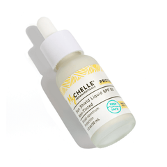 A bottle of MyCHELLE Sun Shield Liquid SPF 50 Non-Tinted sunscreen with a dropper cap.
